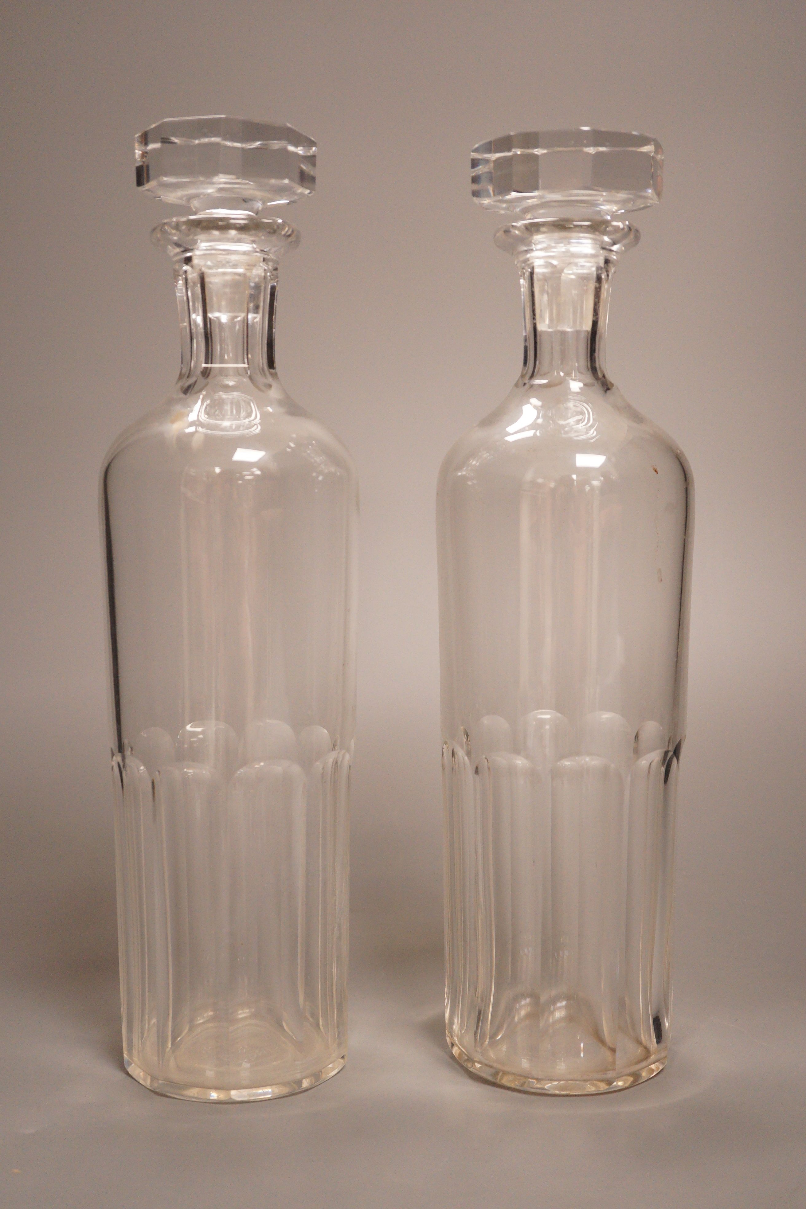 A pair of Baccarat for Hermes glass decanters, 29cm